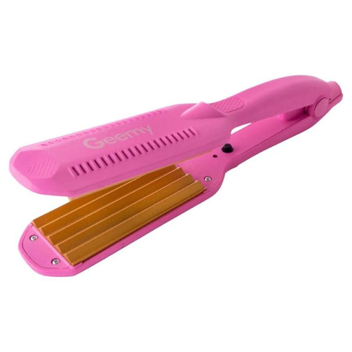 The Gemei PRO Crepe Iron GM-1959, shown open with wide gold ceramic plates, highlights its textured surface for bold zigzag curls.